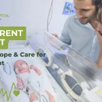 Parent holding newborn baby’s hand in NICU incubator showing emotional support and care during neonatal intensive care stay